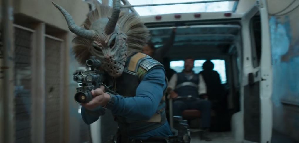 Erik Killmonger wears a mask while helping Klaue to escape